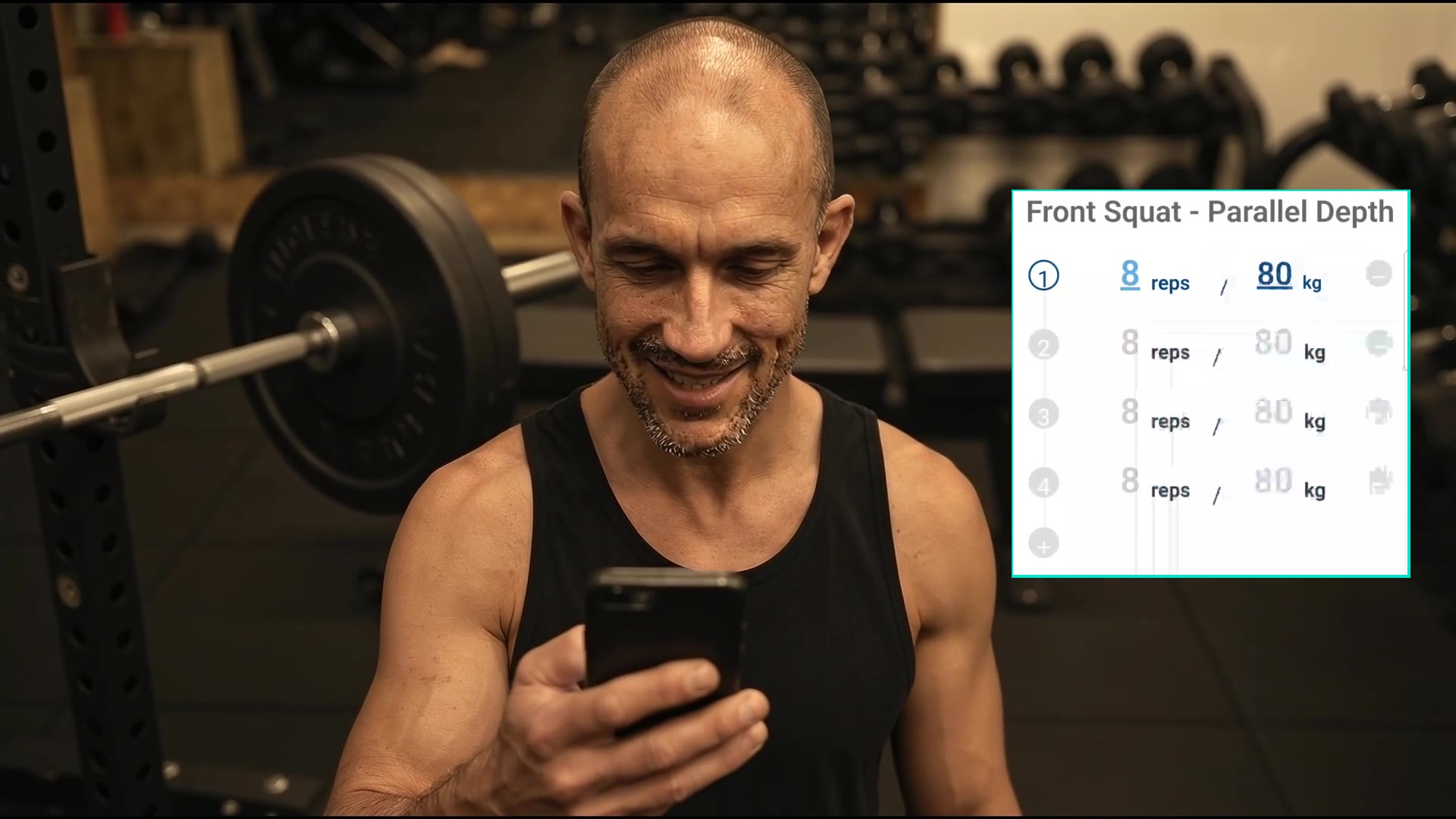 Peter typing a set into a workout-log app on his phone between sets — the manual way.